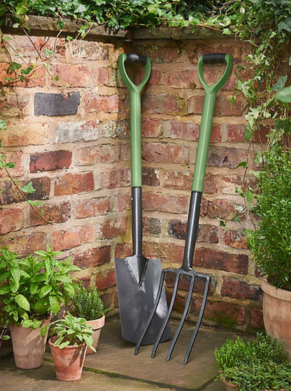 Sturdy steel garden spade with wooden handle for digging and planting in the garden
